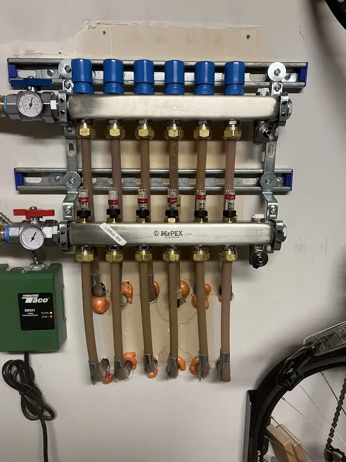 Plumber performing Water Heater Repair at a residential property in Stowe